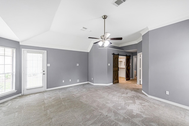 6614 Cypress Village Dr, Sugar Land, TX 77479 - unfurnished living room featuring lofted ceiling, light colored carpet, a barn door, baseboards, and ceiling fan