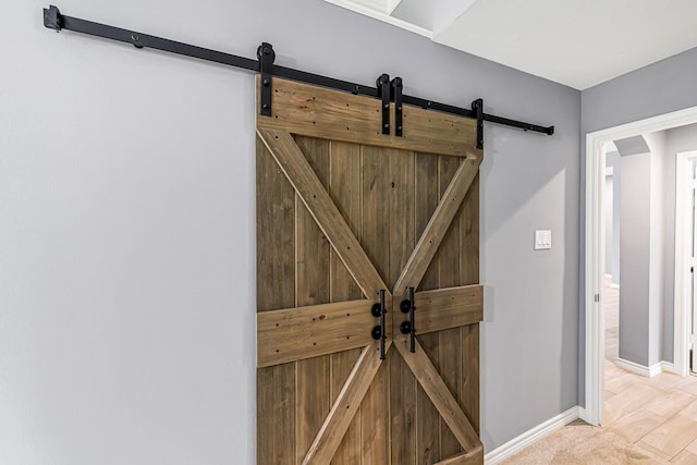 6614 Cypress Village Dr, Sugar Land, TX 77479 - detailed view of a barn door and baseboards