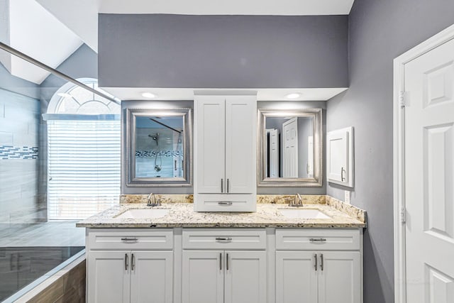 6614 Cypress Village Dr, Sugar Land, TX 77479 - full bathroom with a tile shower, double vanity, and healthy amount of natural light