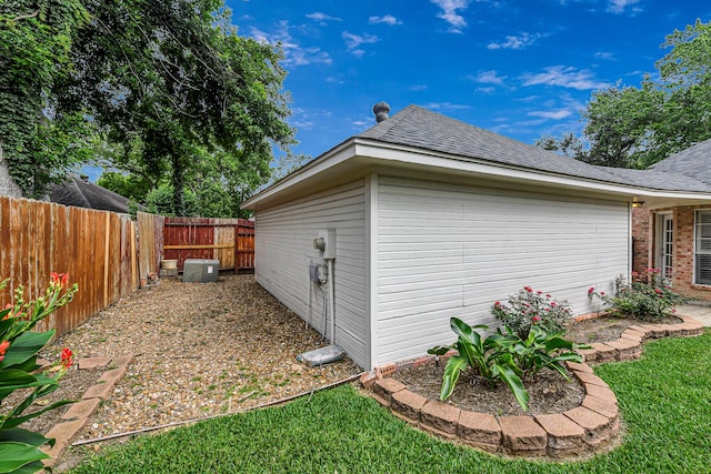 6614 Cypress Village Dr, Sugar Land, TX 77479 - view of property exterior featuring a fenced backyard and roof with shingles