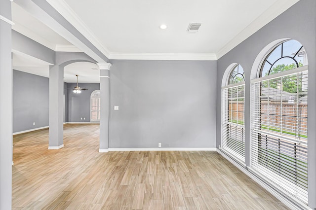 6614 Cypress Village Dr, Sugar Land, TX 77479 - unfurnished room with decorative columns, a ceiling fan, light wood-style floors, ornamental molding, and baseboards