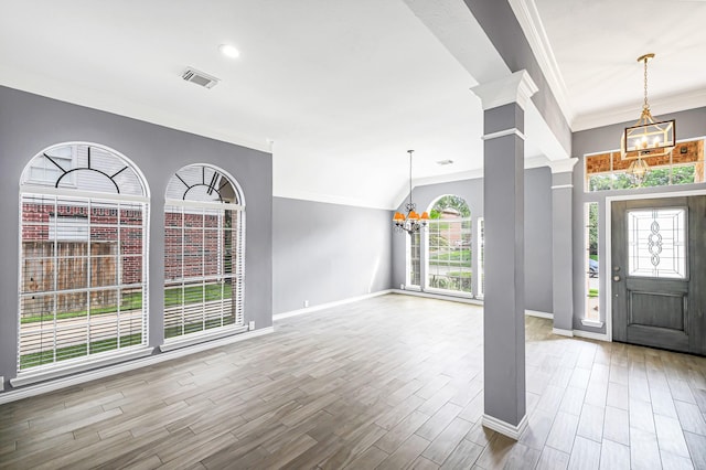 6614 Cypress Village Dr, Sugar Land, TX 77479 - entryway featuring a chandelier, ornamental molding, decorative columns, baseboards, and wood finished floors