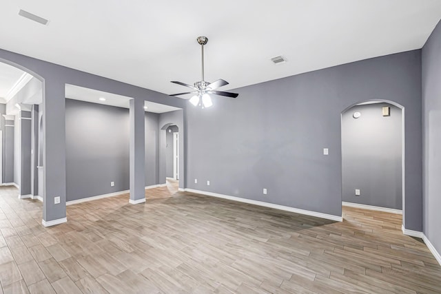 6614 Cypress Village Dr, Sugar Land, TX 77479 - unfurnished room with a ceiling fan, light wood-style flooring, baseboards, arched walkways, and recessed lighting