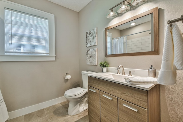 1522 Munger St, Houston, TX 77023 - bathroom with baseboards, toilet, vanity, a shower with curtain, and tile patterned flooring