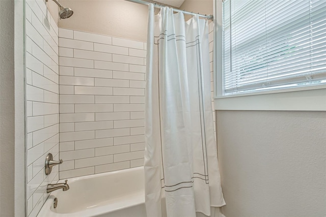 1522 Munger St, Houston, TX 77023 - bathroom with shower / bath combination with curtain and a textured wall