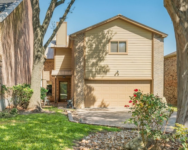 112 Cove Pt, Montgomery, TX 77356 - view of front facade with brick siding, driveway, an attached garage, and a front lawn