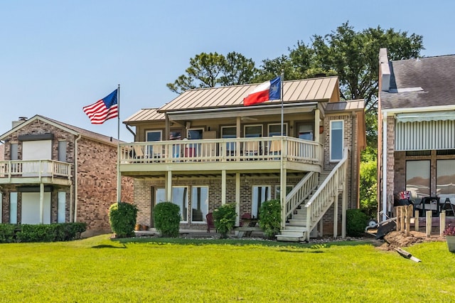 112 Cove Pt, Montgomery, TX 77356 - rear view of property with a standing seam roof, a yard, brick siding, and metal roof