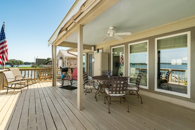 112 Cove Pt, Montgomery, TX 77356 - wooden deck with a ceiling fan, a water view, and outdoor dining area
