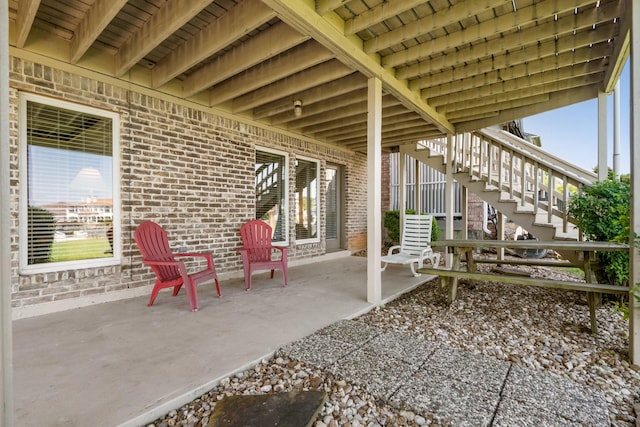 112 Cove Pt, Montgomery, TX 77356 - view of patio featuring stairway