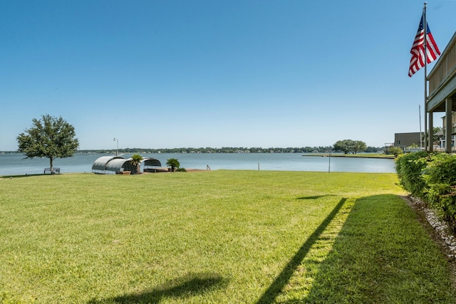 112 Cove Pt, Montgomery, TX 77356 - view of green lawn featuring a water view