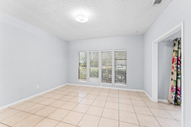1211 Sycamore Ln, Houston, TX 77339 - spare room with a textured ceiling and baseboards
