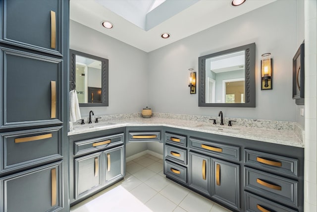 2007 Indiana St, Houston, TX 77019 - bathroom with tile patterned flooring, double vanity, and recessed lighting