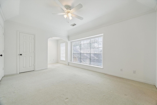 2007 Indiana St, Houston, TX 77019 - unfurnished bedroom featuring light carpet, arched walkways, baseboards, crown molding, and ceiling fan