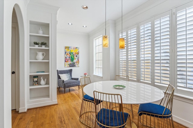 2007 Indiana St, Houston, TX 77019 - dining space with built in features, wood finished floors, baseboards, recessed lighting, and crown molding