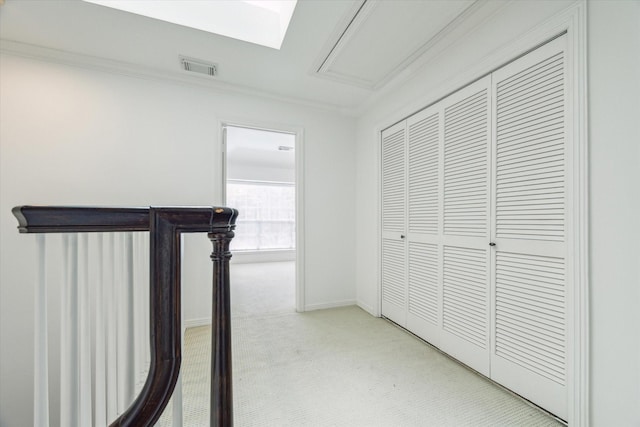 2007 Indiana St, Houston, TX 77019 - hallway featuring light carpet, attic access, and crown molding
