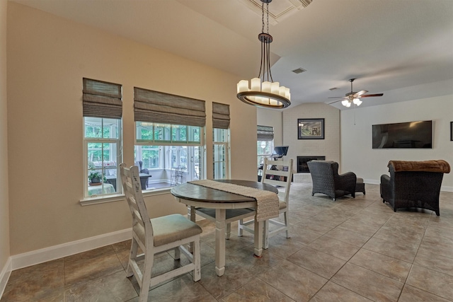 10910 Maddys Ct, Montgomery, TX 77316 - dining area with lofted ceiling, baseboards, light tile patterned floors, a large fireplace, and a ceiling fan