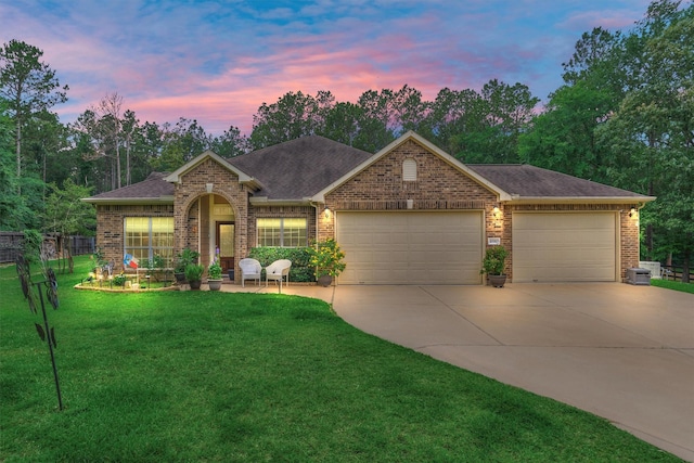 10910 Maddys Ct, Montgomery, TX 77316 - ranch-style house featuring concrete driveway, a garage, brick siding, and a shingled roof