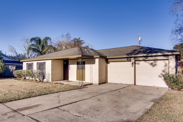304 Lisa Ct, Friendswood, TX 77546 - view of front facade featuring brick siding, an attached garage, and concrete driveway