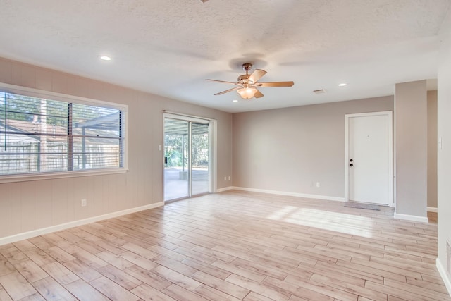 304 Lisa Ct, Friendswood, TX 77546 - empty room featuring ceiling fan, light wood-style floors, baseboards, recessed lighting, and a textured ceiling