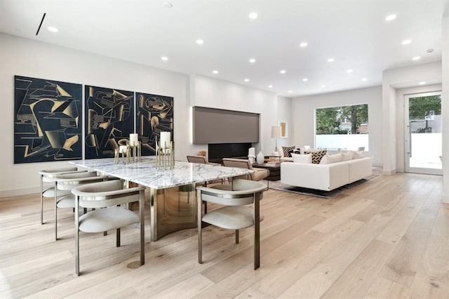 2129 Quenby St, Houston, TX 77005 - dining space featuring light wood-type flooring, recessed lighting, and baseboards