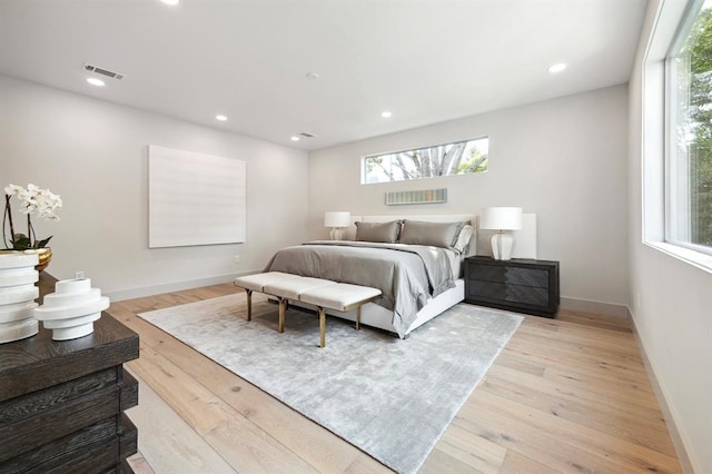 2129 Quenby St, Houston, TX 77005 - bedroom featuring multiple windows, light wood-type flooring, baseboards, and recessed lighting