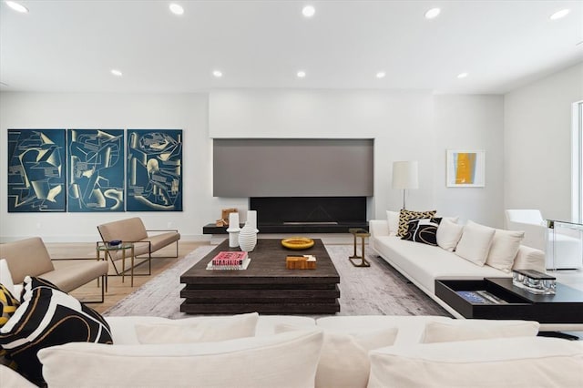 2129 Quenby St, Houston, TX 77005 - living area featuring wood finished floors, recessed lighting, and baseboards