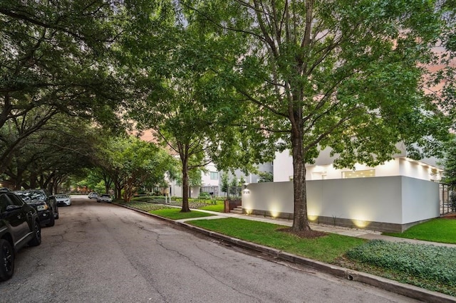 2129 Quenby St, Houston, TX 77005 - view of asphalt road featuring sidewalks and curbs