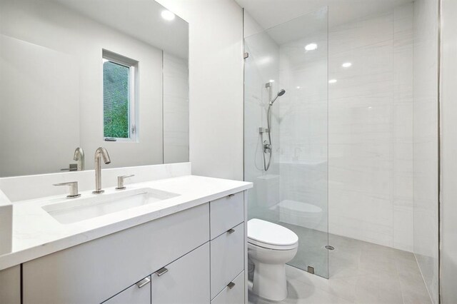 2129 Quenby St, Houston, TX 77005 - bathroom featuring toilet, vanity, a walk in shower, and recessed lighting