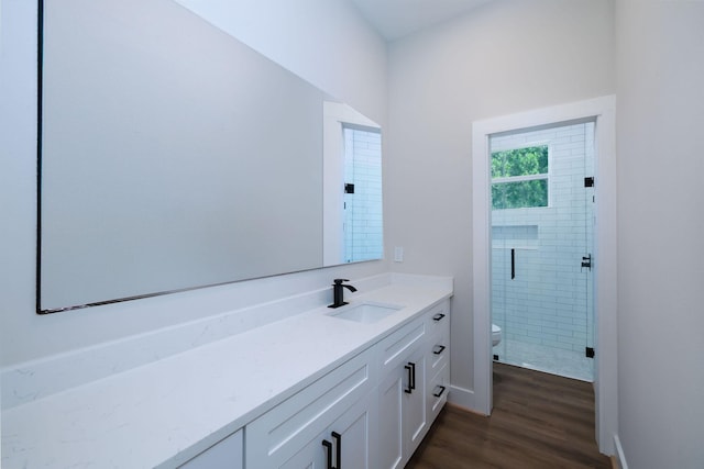 354 Peach Point Ln, Trinity, TX 75862 - bathroom with toilet, vanity, wood finished floors, and a stall shower