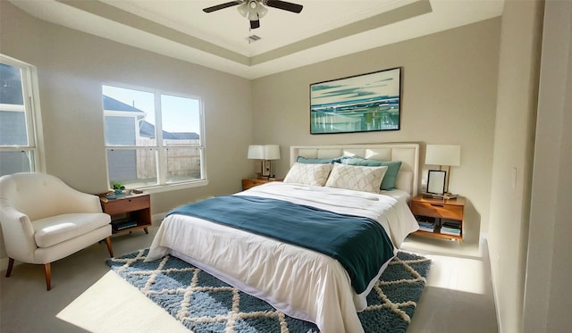 1306 Hidden Oaks Dr, Tomball, TX 77375 - bedroom featuring a tray ceiling and a ceiling fan
