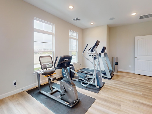 1306 Hidden Oaks Dr, Tomball, TX 77375 - workout area featuring plenty of natural light, light wood finished floors, recessed lighting, and baseboards
