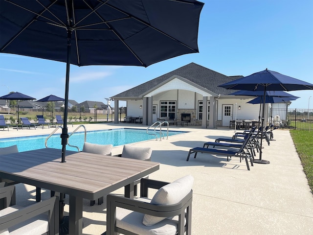 1306 Hidden Oaks Dr, Tomball, TX 77375 - community pool with outdoor dining area and a patio