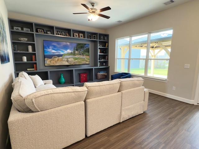 1306 Hidden Oaks Dr, Tomball, TX 77375 - living area featuring dark wood-style flooring, a ceiling fan, baseboards, and built in features
