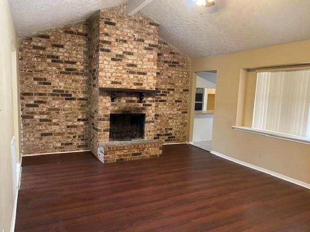 6662 Canyon Way Dr, Houston, TX 77086 - unfurnished living room featuring wood finished floors, a textured ceiling, baseboards, and a fireplace