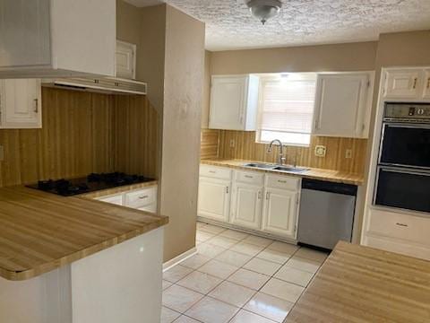 6662 Canyon Way Dr, Houston, TX 77086 - kitchen featuring dishwasher, double oven, a sink, white cabinetry, and black gas stovetop
