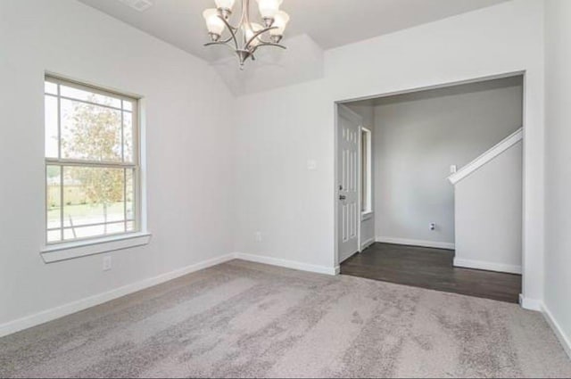 2726 Little Caney Way, Conroe, TX 77301 - carpeted spare room with a chandelier, healthy amount of natural light, and baseboards