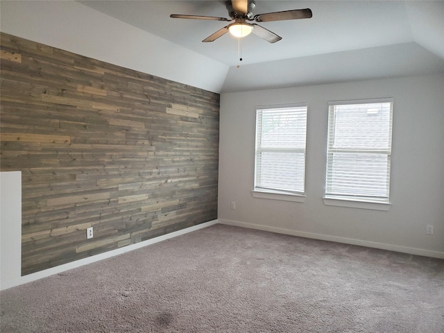 2726 Little Caney Way, Conroe, TX 77301 - unfurnished room with wood walls, a ceiling fan, vaulted ceiling, carpet floors, and baseboards