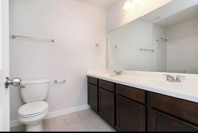 2726 Little Caney Way, Conroe, TX 77301 - full bath with toilet, baseboards, double vanity, tile patterned flooring, and a shower