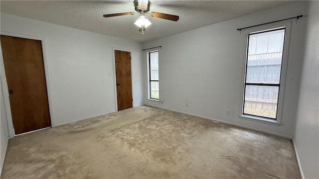 213 Yuma Dr, Victoria, TX 77904 - carpeted empty room featuring a ceiling fan, a textured ceiling, and baseboards
