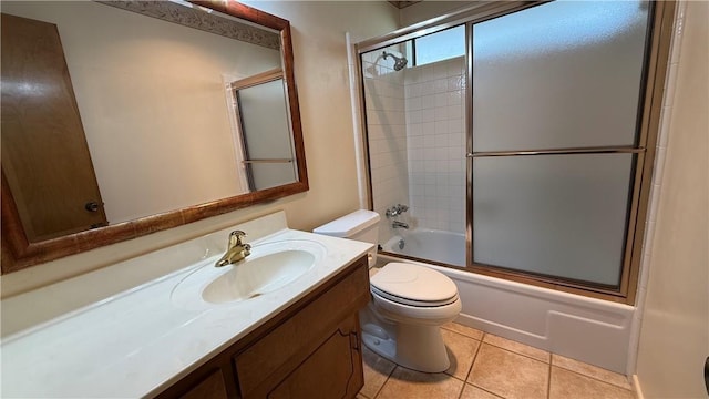 213 Yuma Dr, Victoria, TX 77904 - full bathroom with toilet, shower / bath combination with glass door, vanity, and tile patterned flooring