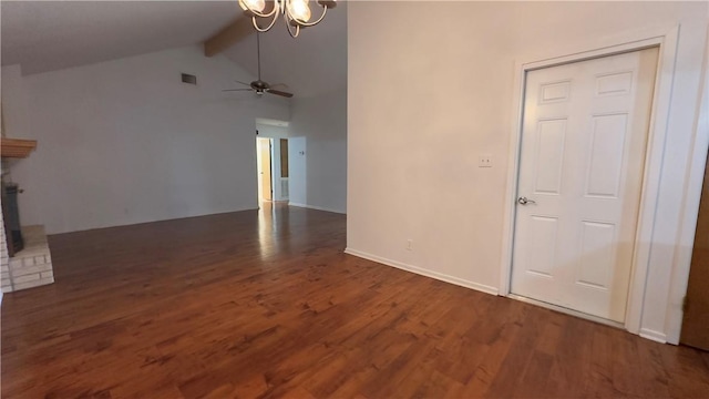 213 Yuma Dr, Victoria, TX 77904 - unfurnished living room featuring beamed ceiling, wood finished floors, a chandelier, ceiling fan, and high vaulted ceiling