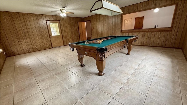 213 Yuma Dr, Victoria, TX 77904 - rec room featuring wooden walls, ceiling fan, billiards table, light tile patterned floors, and a textured ceiling