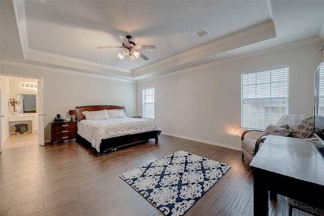 20810 Mansfield Bay Ln, Richmond, TX 77407 - bedroom with a tray ceiling, baseboards, dark wood-style flooring, ornamental molding, and ceiling fan
