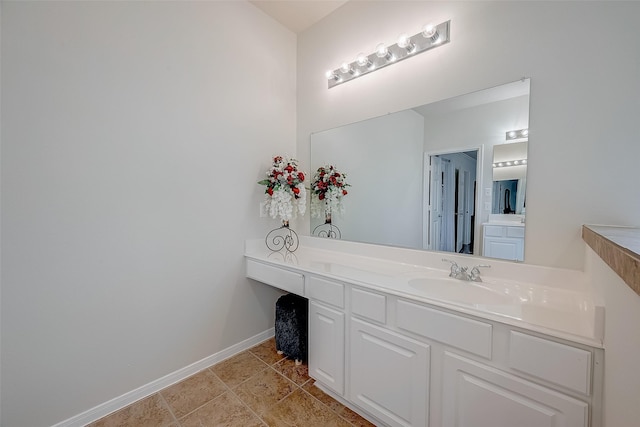20810 Mansfield Bay Ln, Richmond, TX 77407 - bathroom featuring vanity, baseboards, and tile patterned floors