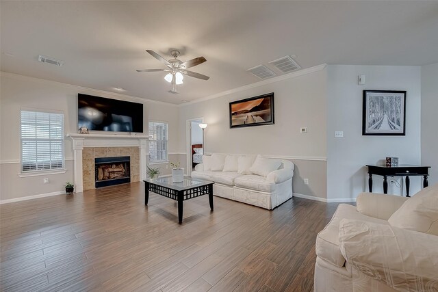 20810 Mansfield Bay Ln, Richmond, TX 77407 - living room with a ceiling fan, wood finished floors, ornamental molding, healthy amount of natural light, and baseboards