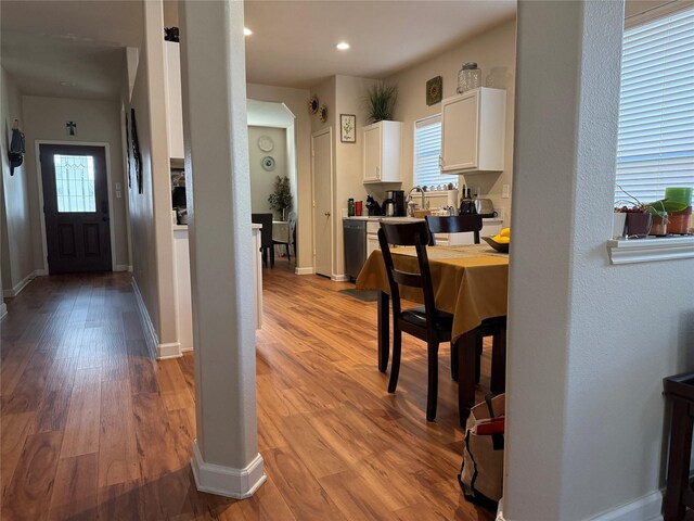19307 Desert Moon Dr, Cypress, TX 77433 - kitchen featuring white cabinets, light wood-type flooring, baseboards, recessed lighting, and light countertops