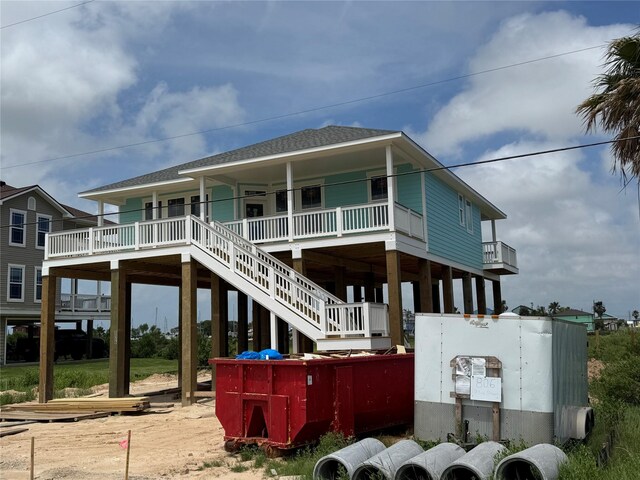 806 93rd St, Galveston, TX 77554 - back of property featuring covered porch and a shingled roof