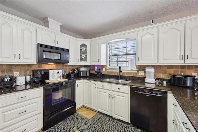 504 County Road 763 N, Buna, TX 77612 - kitchen with black appliances, a sink, white cabinets, tasteful backsplash, and a textured ceiling