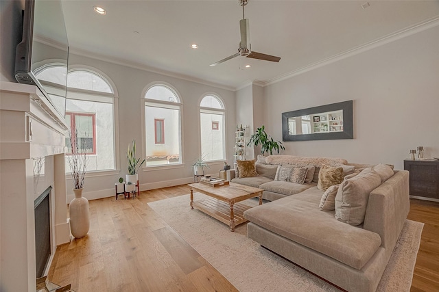 5213 Feagan St Unit H, Houston, TX 77007 - living room with crown molding, ceiling fan, plenty of natural light, light wood-style floors, and recessed lighting
