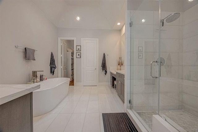 5213 Feagan St Unit H, Houston, TX 77007 - full bathroom featuring vanity, a stall shower, a freestanding tub, tile patterned floors, and recessed lighting